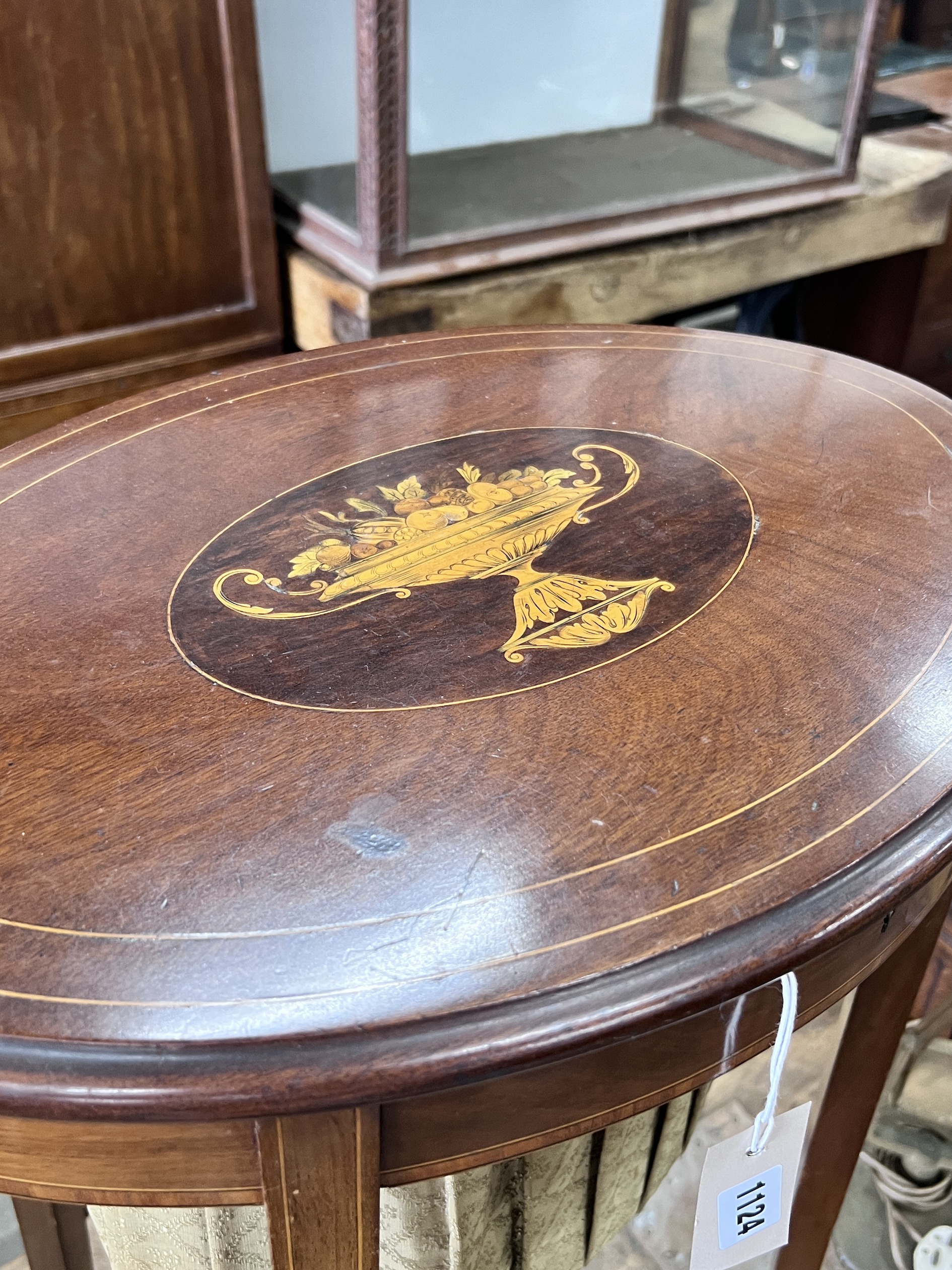 An Edwardian marquetry inlaid oval mahogany work table, width 52cm, depth 37cm, height 78cm